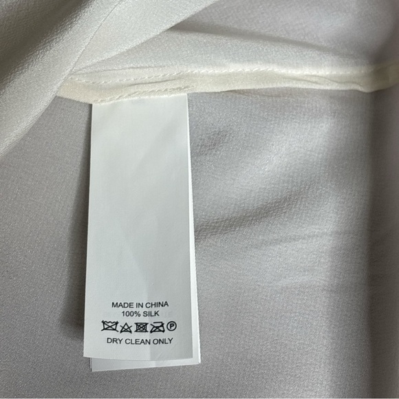 Kate Spade Cream Ruffle Neck Blouse
100% Silk - Picture 4 of 5